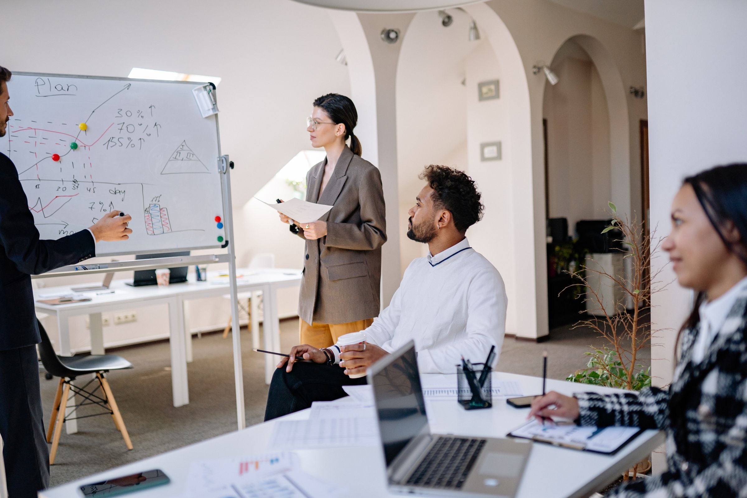 A team discussing a strategy in a bright office meeting