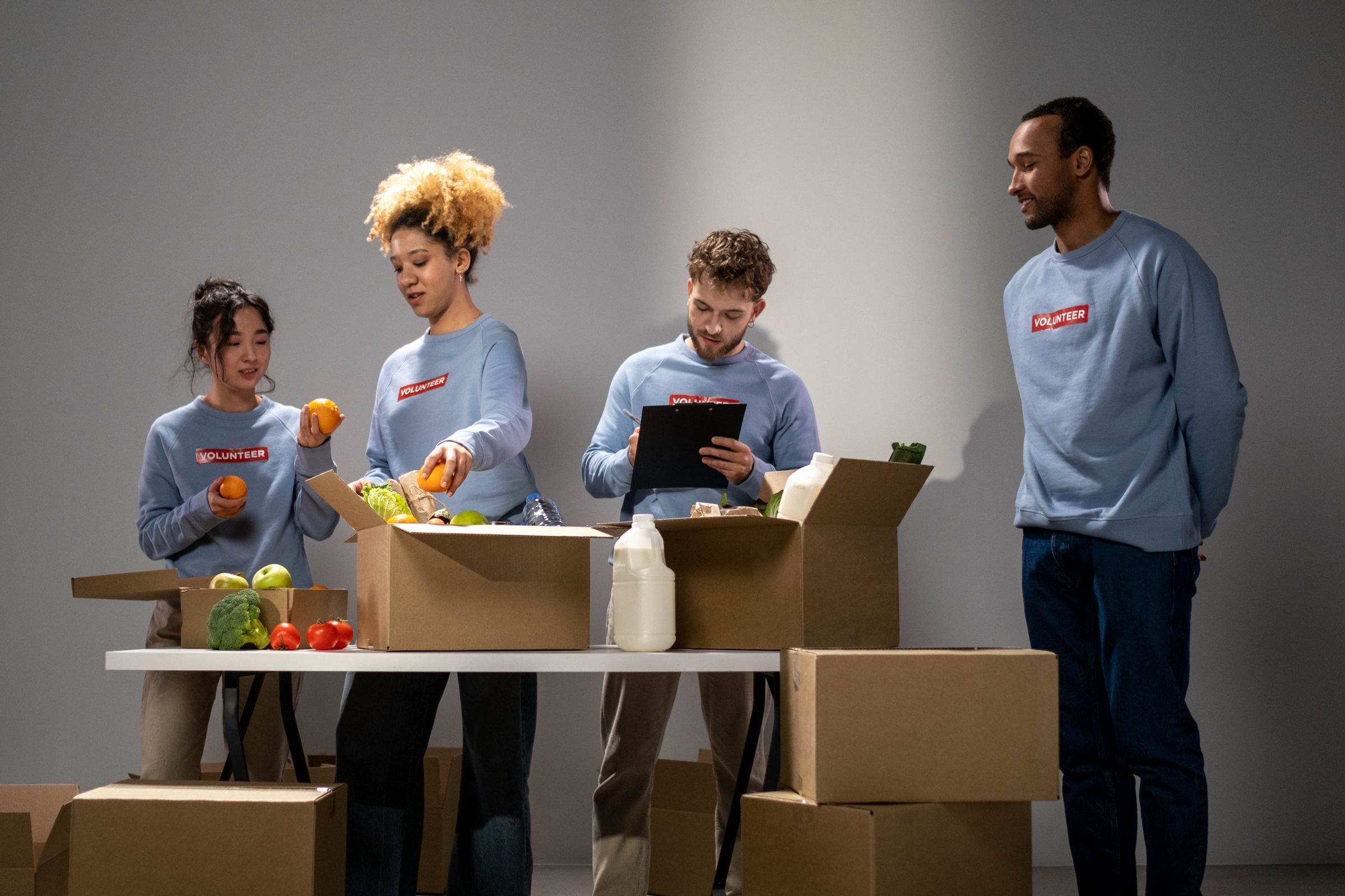 Volunteers packing food donations at a community centre