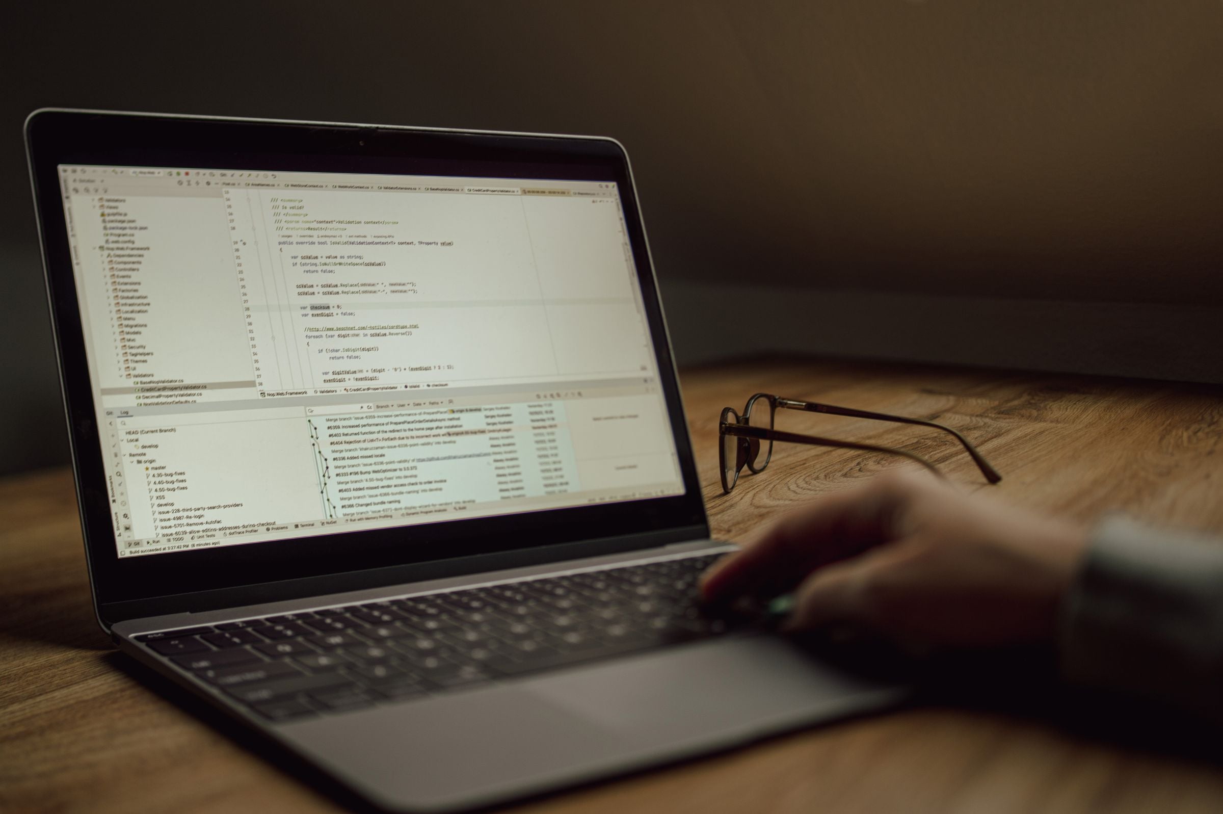A developer working on code at a laptop