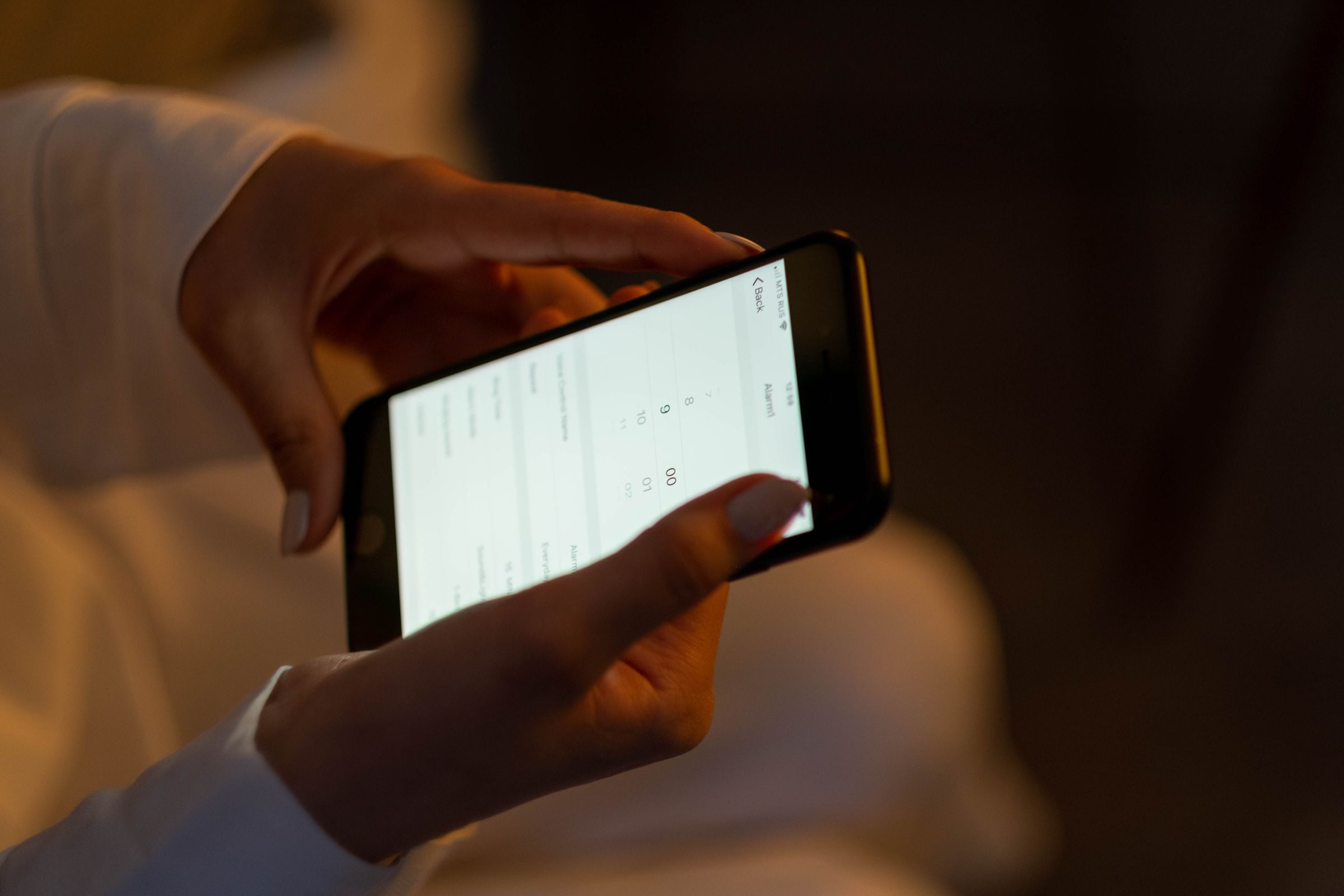Hands using an app on a smartphone